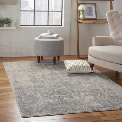 Ivory Abstract Power-Loomed Synthetic 5'3" x 7'3" Area Rug