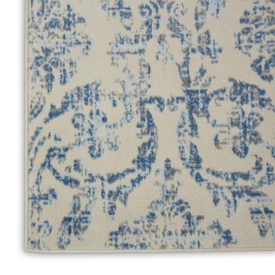Elegant Ivory and Blue Damask 7' x 10' Synthetic Area Rug