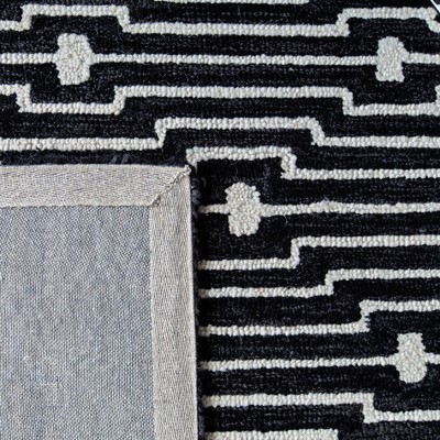 Ivory and Charcoal Round Tufted Wool Rug