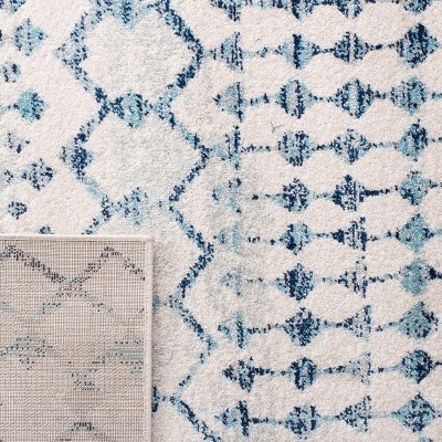 Ivory and Turquoise Geometric Synthetic Area Rug