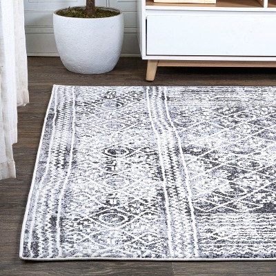 Ivory and Black Geometric Synthetic 8' x 10' Area Rug