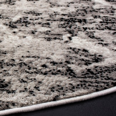 Charcoal and Ivory Round Medallion Synthetic Area Rug