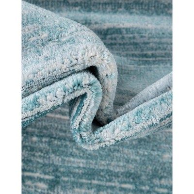 Turquoise and Ivory Rectangular Synthetic Area Rug
