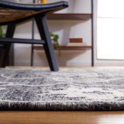Handmade Black and Ivory Synthetic Flat Woven 6' x 9' Area Rug