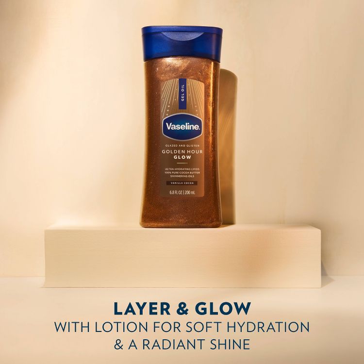 Vaseline Golden Hour Glow, 6.8 fl oz. A shimmering lotion with cocoa butter and lipids for soft hydration, set on a creamy beige pedestal.