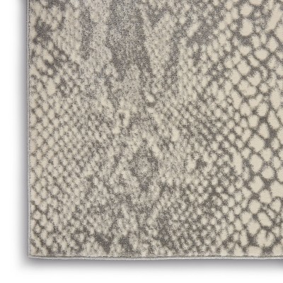 Ivory and Grey 5' x 7' Animal Print Synthetic Area Rug