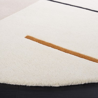 Handmade Black and Ivory Wool Round Tufted Rug