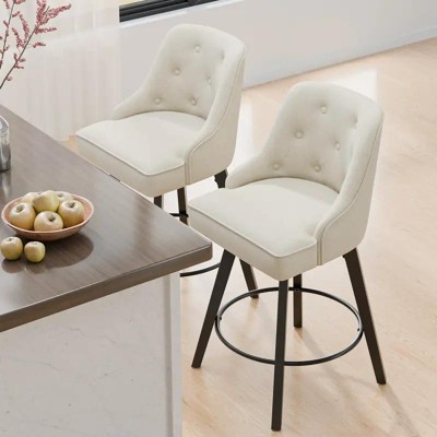 Two cream bar stools at a kitchen counter