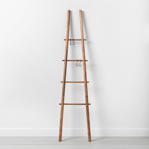 Bring rustic charm to your home with a decorative ladder for blankets or plants