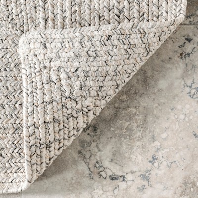 Handmade Ivory Braided 4' x 6' Oval Synthetic Area Rug