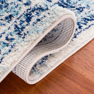 Ivory and Blue 8' x 10' Synthetic Square Area Rug