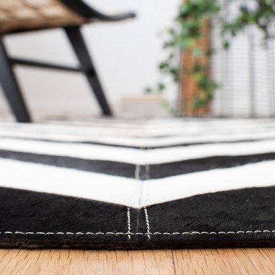 Handmade Black and White Geometric Cowhide Area Rug 4' x 6'