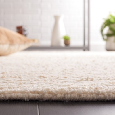 Beige and Ivory Handwoven Wool Shag Area Rug 3' x 5'