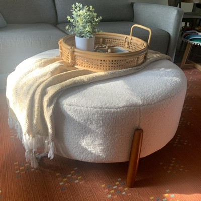 Elroy sherpa round ottoman deals with wood legs cream