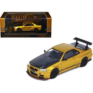 Nissan Skyline GT-R (R34) RHD Gold Metallic with Carbon Hood and Trunk 1/64 Die Cast Model Car by Inno Models - 1 of 4