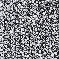 white flower on black background