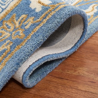 Blue and Ivory Hand Tufted Wool Area Rug 5' x 8'