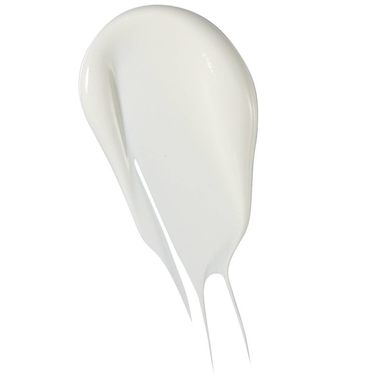 A smear of white colored sunscreen with a smooth texture.