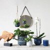 Storied Home Stoneware Footed Planter with Splatter Design, White and Blue - 4 of 4