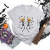 Simply Sage Market Women's Pumpkin Skeleton Short Sleeve Graphic Tee - 2 of 4