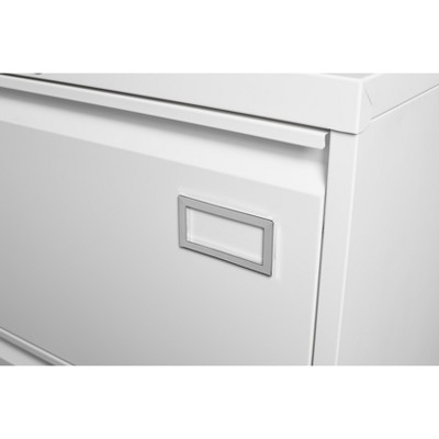 Close-up of cabinet drawer front with label holder