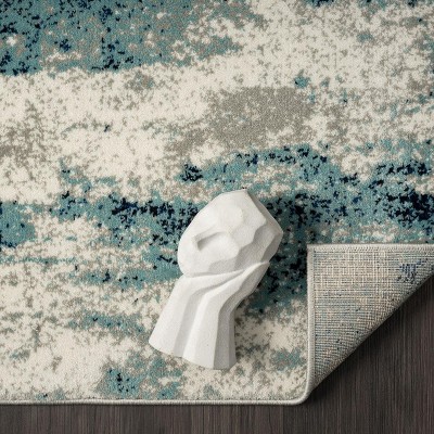 Light Blue Abstract 5' x 7' Stain-Resistant Area Rug