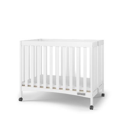 Child Craft London Mini Compact Folding Portable Crib with 2" Crib Mattress & 2 Easy Roll Locking Wheels, Durable Pine Wood Construction