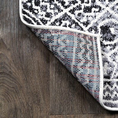Ivory and Black Geometric Synthetic 8' x 10' Area Rug