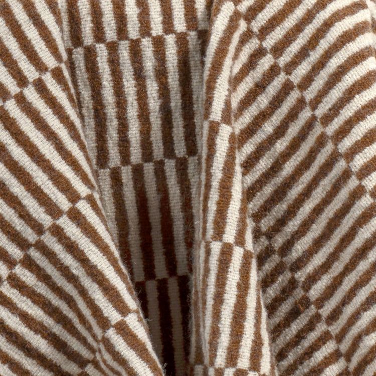 A brown and cream colored striped blanket with a geometric pattern.