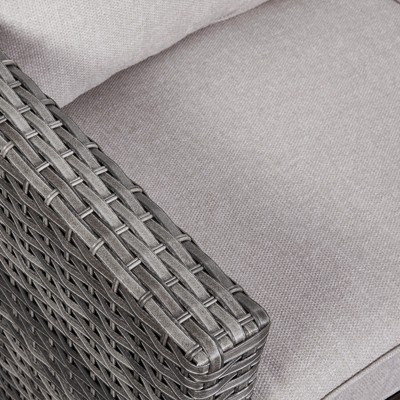 Close-up of woven wicker texture on arm of sofa
