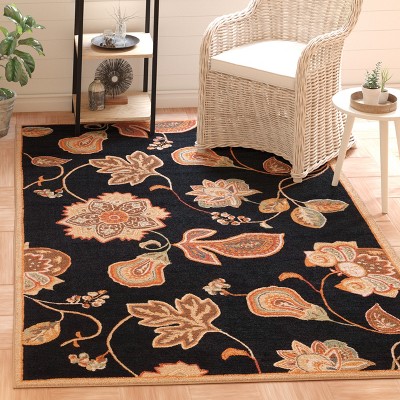 Handmade Black and Orange Floral Wool Area Rug