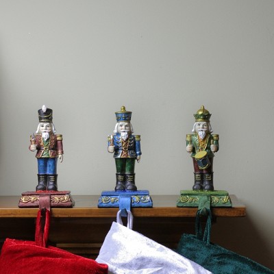 Glittered Nutcracker Stocking Holders Set of Three in Red, Blue, and Green