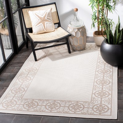 Ivory and Beige Geometric Synthetic Indoor/Outdoor Area Rug