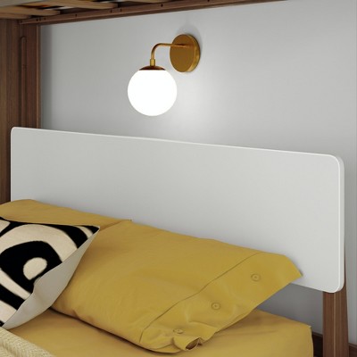 Close-up of white headboard panel on bunk bed