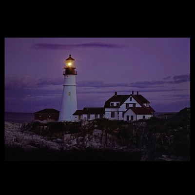 Coastal Lighthouse Home with Purple Sunset Canvas Wall Art