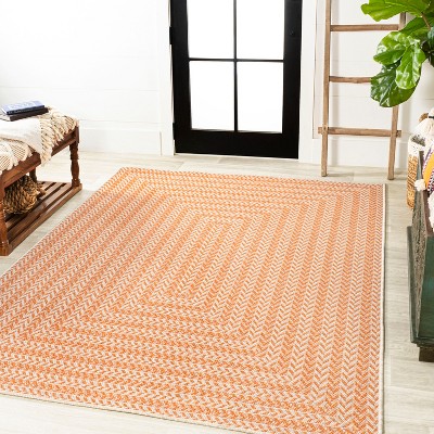 4' x 6' Ivory and Orange Geometric Synthetic Area Rug
