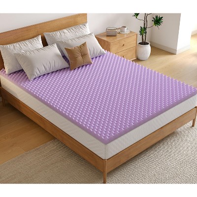 Close-up of lavender egg-crate memory foam topper on bed