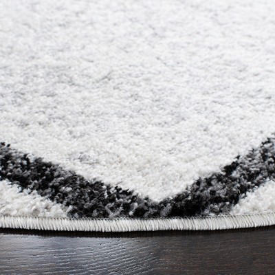 Ivory and Charcoal Geometric Synthetic Area Rug