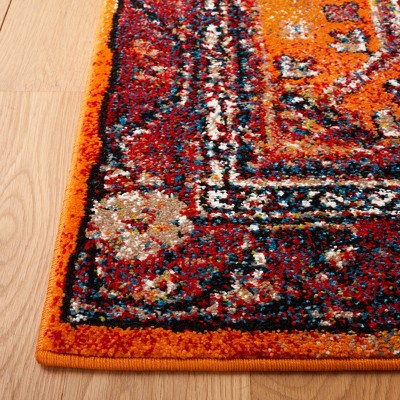 Vintage Orange and Black Synthetic 4' x 6' Area Rug