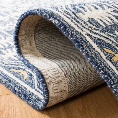 Handmade Blue and Ivory Tufted Wool Area Rug