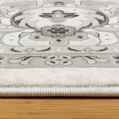 Ivory and Gray Tufted Synthetic 6' x 9' Area Rug