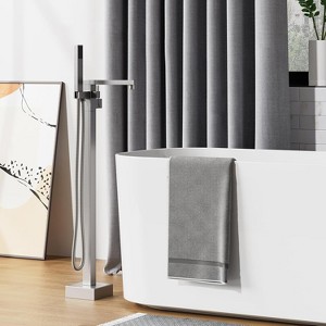 Brushed Nickel Freestanding Tub Filler- Floor mount waterfall faucet with  handheld shower & single handle. - 1 of 4