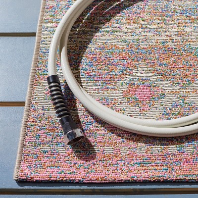 Ivory and Pink Synthetic Flat Woven Outdoor Rug