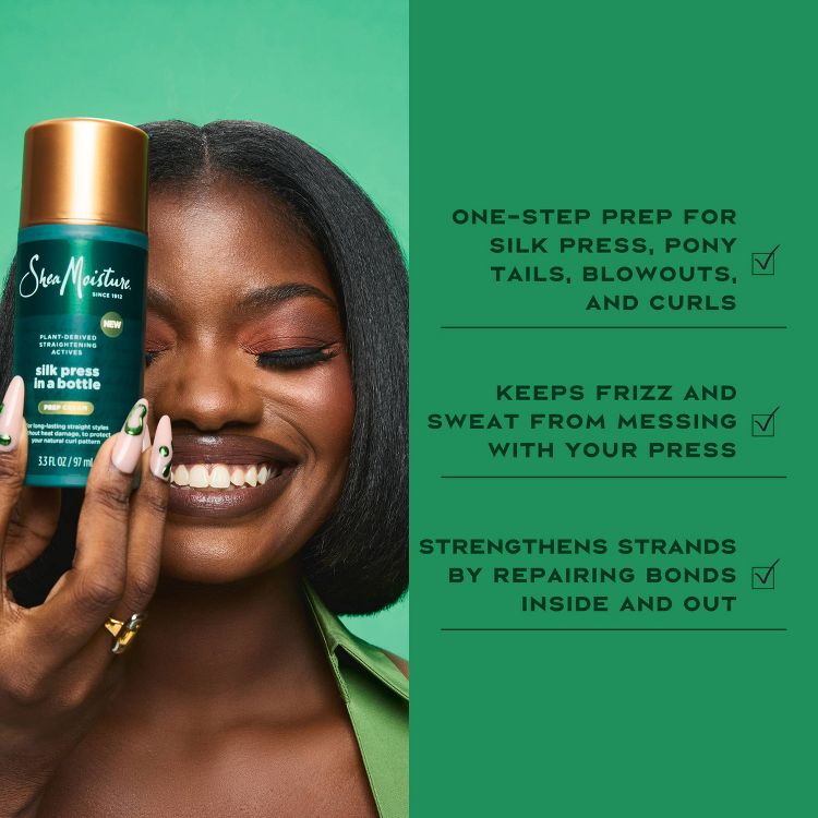A person holding a bottle of Shea Moisture "silk press in a bottle" treatment, with text highlighting its benefits for silk press, ponytails, blowouts, curls, frizz control, and strand strengthening.