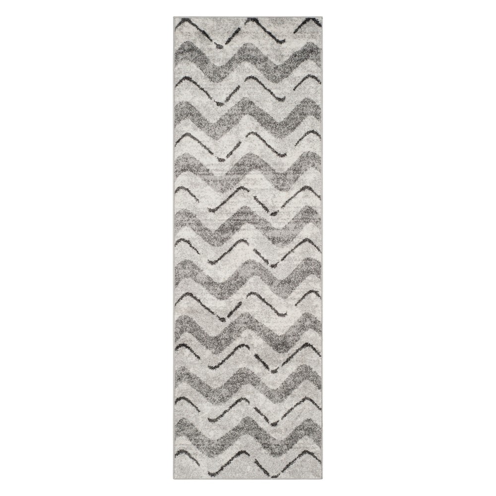 2'6 x6' Chevron Runner Silver/Charcoal - Safavieh Inspired by global travel, the bold colorful motifs and alluring patterns, Briarwood Adirondack Area Rugs translate rustic lodge style into supremely chic, easy-care floor coverings. Made using enhanced polypropylene yarns, Briarwood rugs explore stylish over-dye and antiqued looks, making a striking fashion statement in any room. Safavieh translates rustic lodge style into the supremely chic and easy-care collection. The Briarwood Collection is power loomed using soft yet durable enhanced polypropylene yarns for a comforting feel underfoot and lasting beauty.   Size: 2'6 X6'. Color: One Color. Pattern: Chevron.