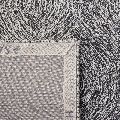 Handmade Black and Ivory Wool Tufted Area Rug, 5' x 8'