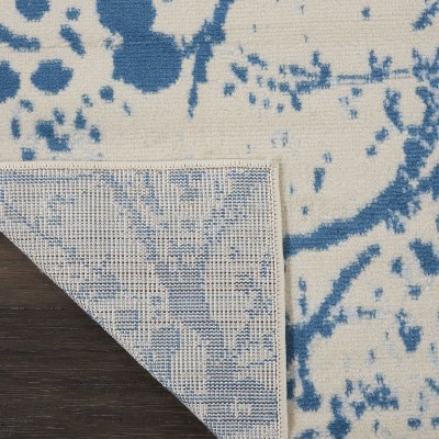 Ivory and Blue Abstract Synthetic 2' x 4' Easy-Care Area Rug