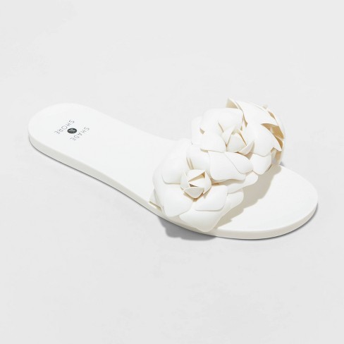 Cream hot sale flip flops