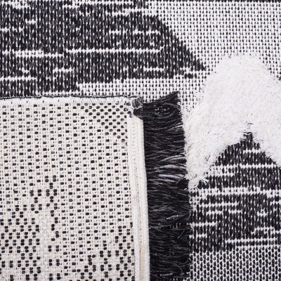 Nomadic Charm Black/Ivory Synthetic 8' x 10' Area Rug