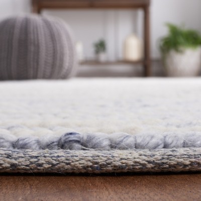 Handmade Ivory and Blue Wool Rectangular Area Rug 4' x 6'